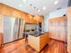Contemporary kitchen with stainless steel appliances, hardwood floors, and a kitchen island at 2902 N Shoreview Pl, Tampa, FL 33602