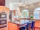 Bright, modern kitchen with an island, granite countertops, stainless steel appliances, and natural light from large windows at 2902 N Shoreview Pl, Tampa, FL 33602