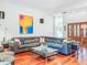 Spacious living room features gleaming hardwood floors, modern decor, comfortable seating, and elegant touches throughout at 2902 N Shoreview Pl, Tampa, FL 33602