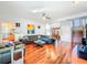 Cozy living room with hardwood floors, modern furniture, and a view of the kitchen and entryway at 2902 N Shoreview Pl, Tampa, FL 33602