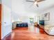 Bright, open main bedroom boasts vaulted ceilings, wood floors, and sunny sitting area at 2902 N Shoreview Pl, Tampa, FL 33602