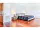 Comfortable primary bedroom boasting rich hardwood floors and filled with natural light at 2902 N Shoreview Pl, Tampa, FL 33602