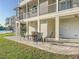 Inviting patio with a fire pit and ample seating for relaxing outdoors, surrounded by lush greenery and beautiful views at 2902 N Shoreview Pl, Tampa, FL 33602
