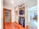 Organized walk-in closet with ample storage space, custom shelving, and easy access to the en-suite bathroom at 2902 N Shoreview Pl, Tampa, FL 33602