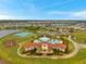 A high angle view of a community center featuring a swimming pool, clubhouse, and other recreational amenities at 5045 Ivory Stone Dr, Wimauma, FL 33598