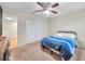 This bedroom includes a ceiling fan, closet, and bureau at 5045 Ivory Stone Dr, Wimauma, FL 33598