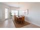 Elegant dining room with wooden table, chandelier, and natural light at 7611 34Th W Ave # 303, Bradenton, FL 34209