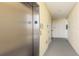 Modern elevator with a '3' label in a clean, well-maintained hallway at 7611 34Th W Ave # 303, Bradenton, FL 34209