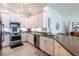 Modern kitchen with white cabinets, stainless steel appliances, and elegant countertops at 7611 34Th W Ave # 303, Bradenton, FL 34209