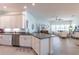 Open-concept kitchen with modern cabinets, stainless steel appliances, and seamless flow to living area at 7611 34Th W Ave # 303, Bradenton, FL 34209