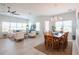 Bright open-concept living and dining area with lots of windows and comfortable seating at 7611 34Th W Ave # 303, Bradenton, FL 34209