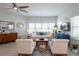 Comfortable living room with ceiling fan and large windows at 7611 34Th W Ave # 303, Bradenton, FL 34209