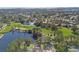 Overhead shot showcasing a golf course community with lush landscaping and tranquil waters at 2506 Madrid Way S, St Petersburg, FL 33712