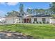 Charming two-story home with a well-maintained front yard and brick facade at 2506 Madrid Way S, St Petersburg, FL 33712