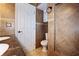 Bathroom featuring double sink vanity, toilet, and tile walls at 3087 Duane Ave, Oldsmar, FL 34677