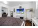 Bright bedroom features modern decor, wood floors, and a flat-screen TV for a comfortable, stylish space at 3087 Duane Ave, Oldsmar, FL 34677