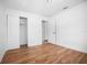 Bedroom with hardwood flooring, walk-in closet, and ensuite bathroom at 3087 Duane Ave, Oldsmar, FL 34677