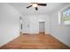 Bedroom featuring hardwood flooring, ample natural light, and closet space at 3087 Duane Ave, Oldsmar, FL 34677