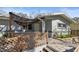 Inviting entrance with stone steps, stylish wooden fence, and covered porch, ideal for enjoying the outdoors at 3087 Duane Ave, Oldsmar, FL 34677