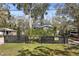 Charming home with black fence and lush greenery, nestled in a serene neighborhood at 3087 Duane Ave, Oldsmar, FL 34677