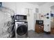 Laundry area features a washer, microwave and utility appliances with access to the home at 3087 Duane Ave, Oldsmar, FL 34677