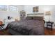 Bedroom with a large bed, desk, and natural light from the window at 3087 Duane Ave, Oldsmar, FL 34677