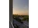 Scenic community view showcasing lush greenery, palm trees, community areas and a glimpse of the water at 3244 Mangrove Point Dr, Ruskin, FL 33570