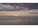 Breathtaking waterfront view featuring expansive water, skyline, and colorful cloud formations at sunrise or sunset at 3244 Mangrove Point Dr, Ruskin, FL 33570
