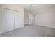 Neutral bedroom with carpeting, a ceiling fan, and a closet for storage at 3801 Luma Dr, Holiday, FL 34691