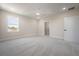 Bedroom featuring neutral walls, plush carpeting, ceiling fan and a walk-in closet at 3801 Luma Dr, Holiday, FL 34691