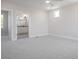 Neutral bedroom with plush carpet leading to an ensuite bathroom with granite vanity at 3801 Luma Dr, Holiday, FL 34691