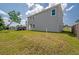 View of the home's exterior highlighting the well maintained lawn at 3801 Luma Dr, Holiday, FL 34691