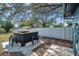 Backyard featuring an outdoor bar with seating and shower, great for entertaining and relaxation at 4412 W Pearl Ave, Tampa, FL 33611