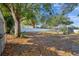 Large, fenced backyard with a screened-in pool and spacious area for outdoor enjoyment at 4412 W Pearl Ave, Tampa, FL 33611