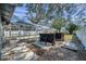 Spacious backyard featuring a custom outdoor bar, patio area, and screened-in pool at 4412 W Pearl Ave, Tampa, FL 33611