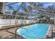 Inviting screened-in pool with clear water, perfect for outdoor relaxation and entertainment at 4412 W Pearl Ave, Tampa, FL 33611