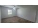 Bedroom featuring a ceiling fan, window and neutral carpeting at 4725 Michael Ct # 131, Tampa, FL 33614