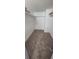 Spacious walk-in closet featuring multiple levels of shelving and carpet at 4725 Michael Ct # 131, Tampa, FL 33614