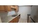 Efficient kitchen with a stainless steel double sink, cabinets and modern appliances at 4725 Michael Ct # 131, Tampa, FL 33614