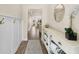 Stylish hallway with wood floors, decorative shelving, and modern accents at 6104 S Main Ave, Tampa, FL 33611