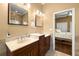 Well-lit bathroom with double sinks, custom cabinetry, and elegant finishes for a spa-like experience at 14739 Vista View Ct, Dade City, FL 33523