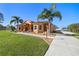 Charming home with a beautiful lawn, meticulous landscaping, and an inviting walkway at 14739 Vista View Ct, Dade City, FL 33523
