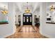 Elegant foyer showcasing high ceilings, arched entryways, and decorative lighting fixtures at 14739 Vista View Ct, Dade City, FL 33523