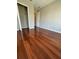 Spacious bedroom with hardwood floors and a walk-in closet at 1621 Fluorshire Dr, Brandon, FL 33511