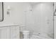 Bright bathroom featuring a glass-enclosed shower, white subway tile, and a stylish vanity at 4614 W Tennyson Ave, Tampa, FL 33629