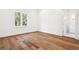 Bedroom with hardwood floors and natural light at 4614 W Tennyson Ave, Tampa, FL 33629