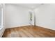 Bedroom with hardwood floors and natural light at 4614 W Tennyson Ave, Tampa, FL 33629