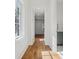 Hallway with natural light and hardwood flooring at 4614 W Tennyson Ave, Tampa, FL 33629