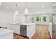 Spacious open kitchen features island with seating and stainless steel appliances at 4614 W Tennyson Ave, Tampa, FL 33629
