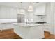 Beautiful kitchen with a large island, stainless steel appliances, and stylish pendant lighting at 4614 W Tennyson Ave, Tampa, FL 33629